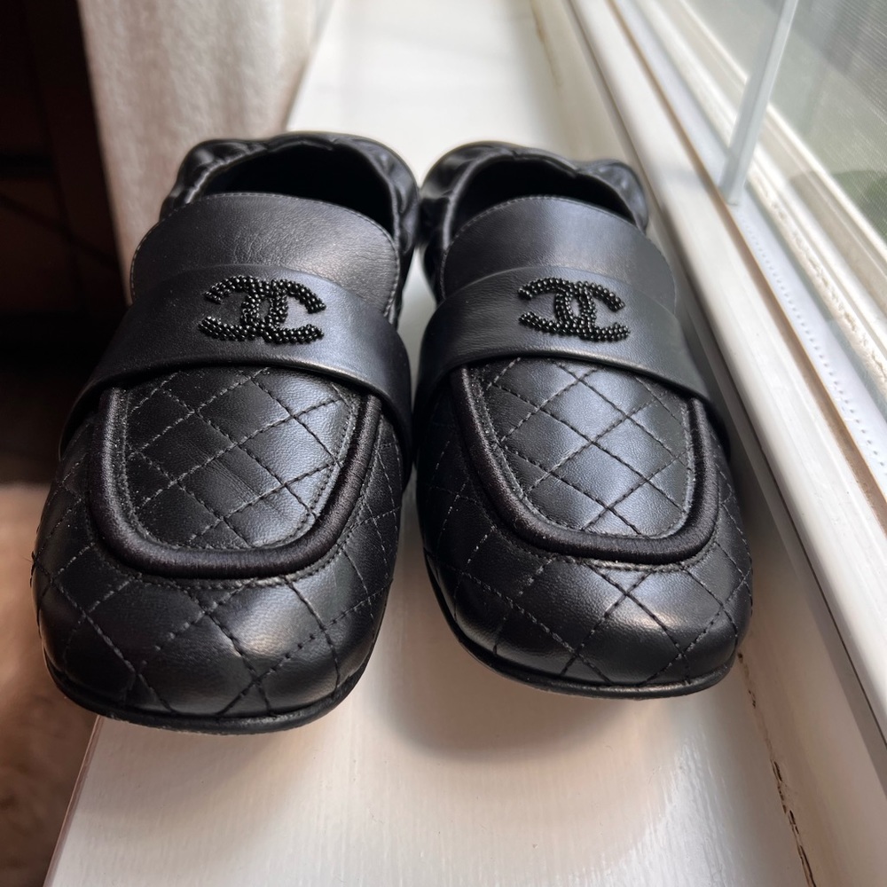 Chanel black leather flats